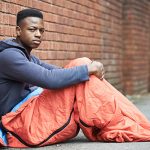 Vulnerable Teenage Boy Sleeping On The Street